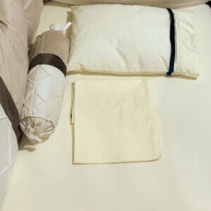 Sábana de cuna crema